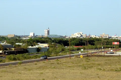 Odessa, Texas skyline seen across open ground