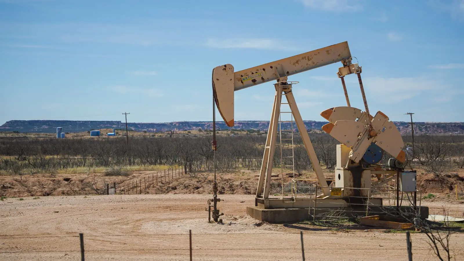 Pumpjack on a caliche pad in West Texas mesquite country